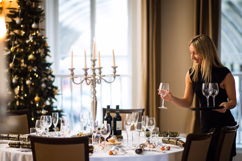 Green Park Brasserie women putting glasses on the tables