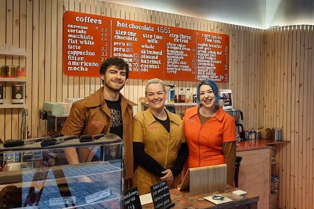 Staff members smiling at the camera in Ruby Hue Chocolate Maker's