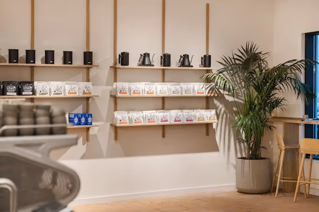 Internal shot of origin coffee. Showing various coffee products on sale.