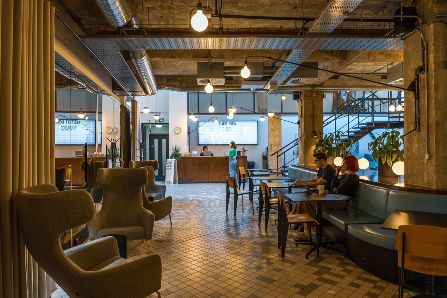 Fora - Albert House Reception Area and Coworking Space with blue cushioned seating and wooden chairs