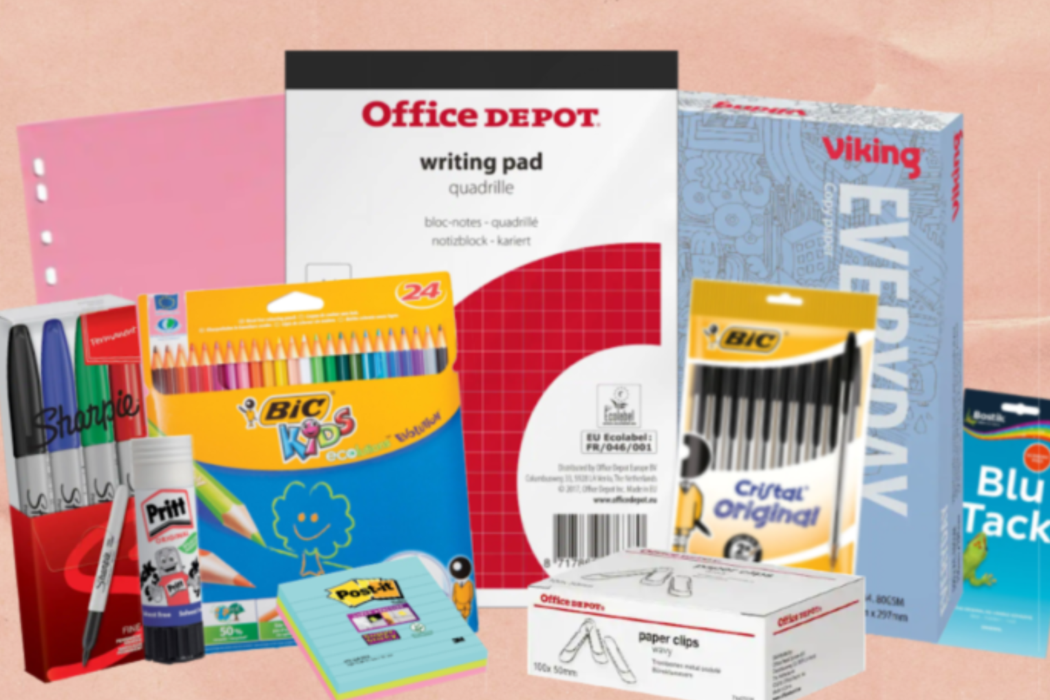A collection of assorted school and office supplies, including a writing pad, colored pencils, markers, glue sticks, sticky notes, and paper clips.