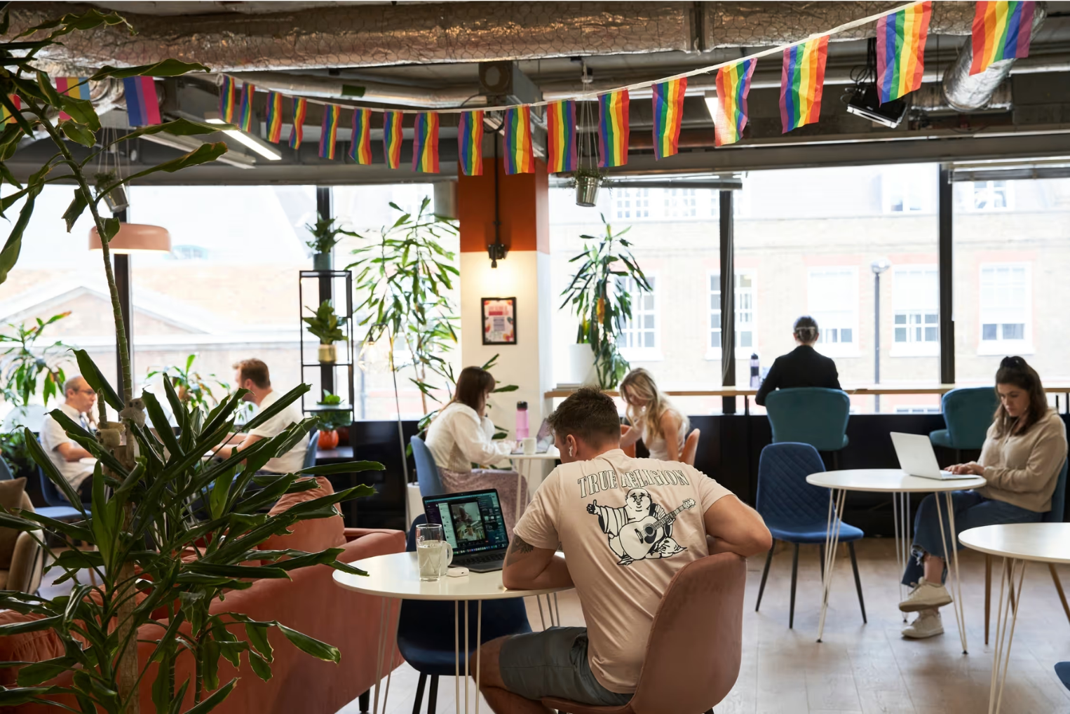 Runway East Borough Market Breakout Space with people sat working on their laptops of conversing.
