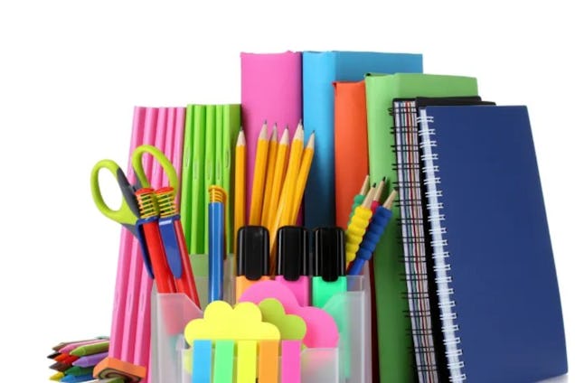 A colourful collection of office supplies, including notebooks, pencils, scissors, and sticky notes.