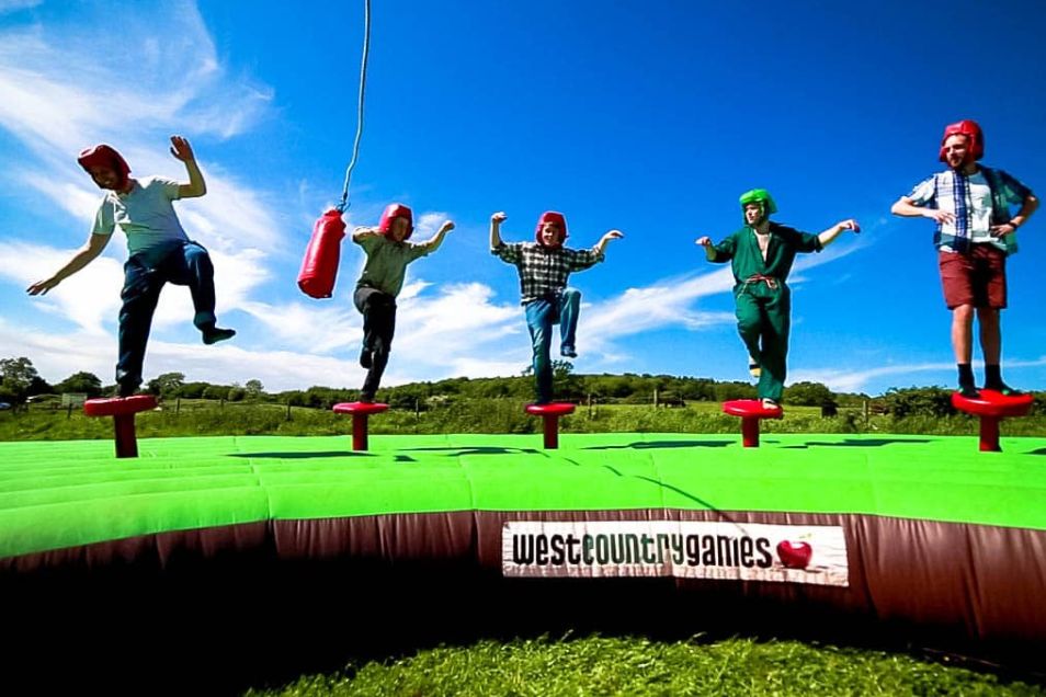 People engaging in a challenge to avoid the red bag