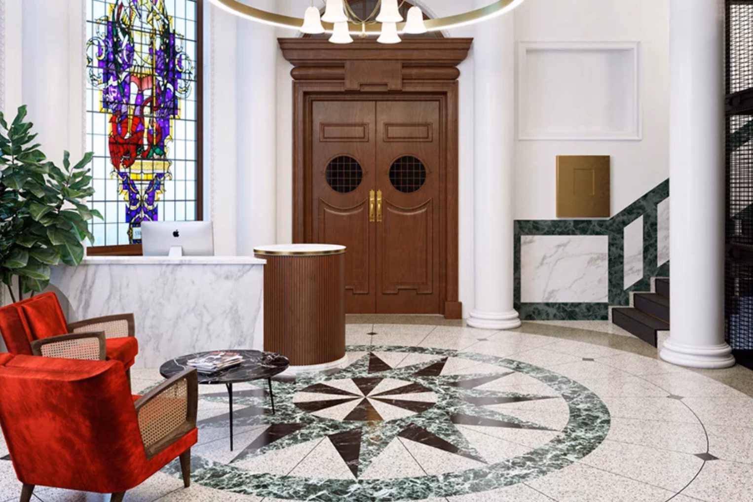 Red chairs and a black table on a floor with a green and white pattern. A white marble desk and a brown counter near wood doors, white columns, and a stained-glass window.