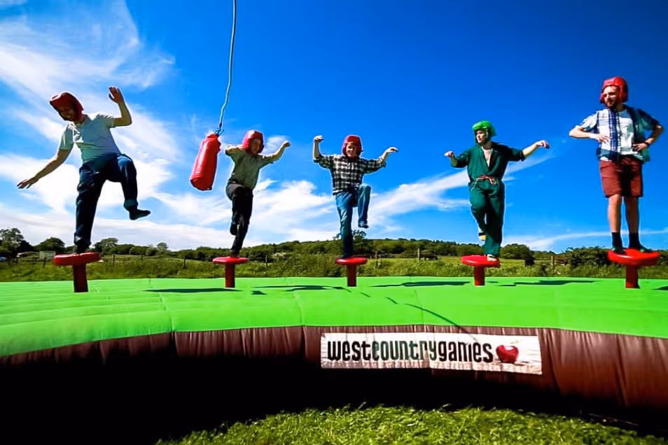 People engaging in a challenge to avoid the red bag