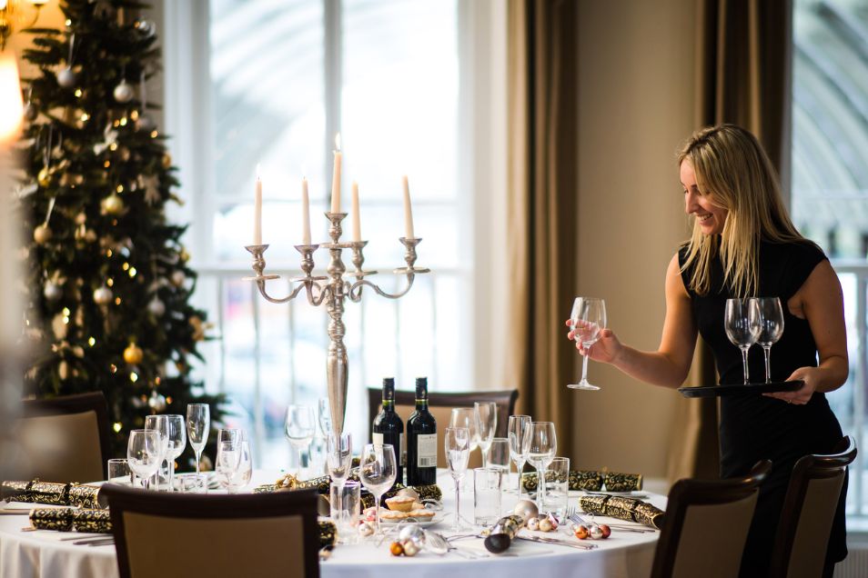Green Park Brasserie women putting glasses on the tables