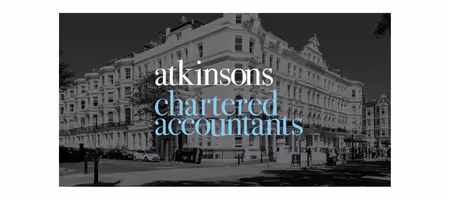 Atkinsons Chartered Accounts logo over a large building