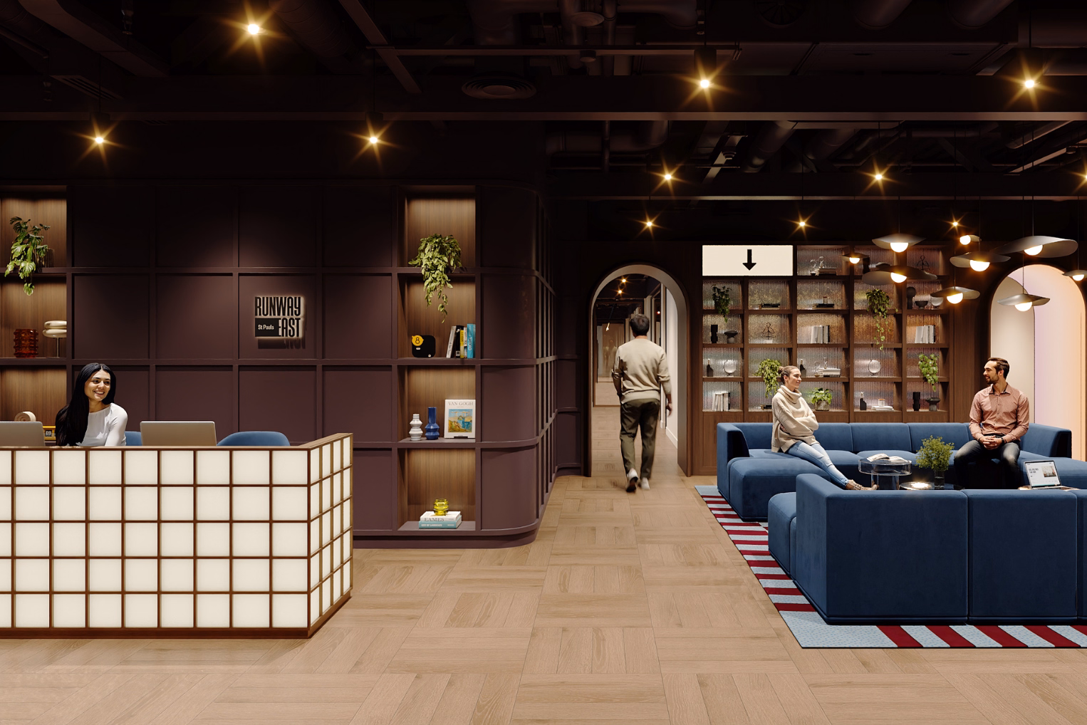 An office reception with a person sitting at a grid desk, a man walking through an archway, and people sitting on blue sofas talking.