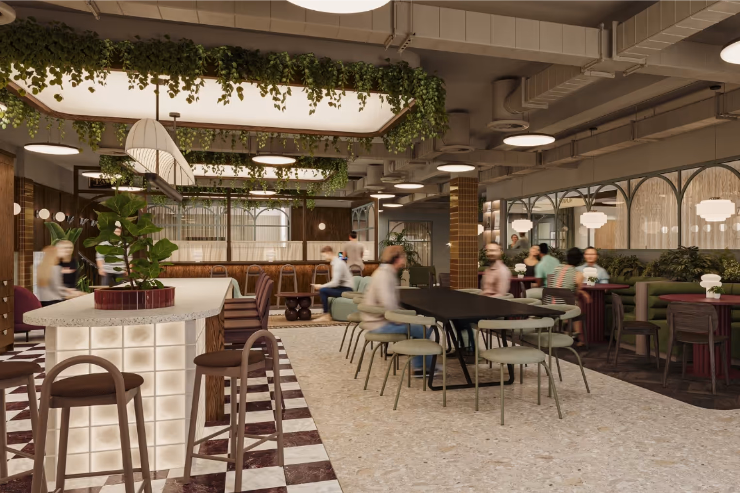 People sit, talk, and walk near a white counter with brown stools and tables with green, brown, and purple chairs.