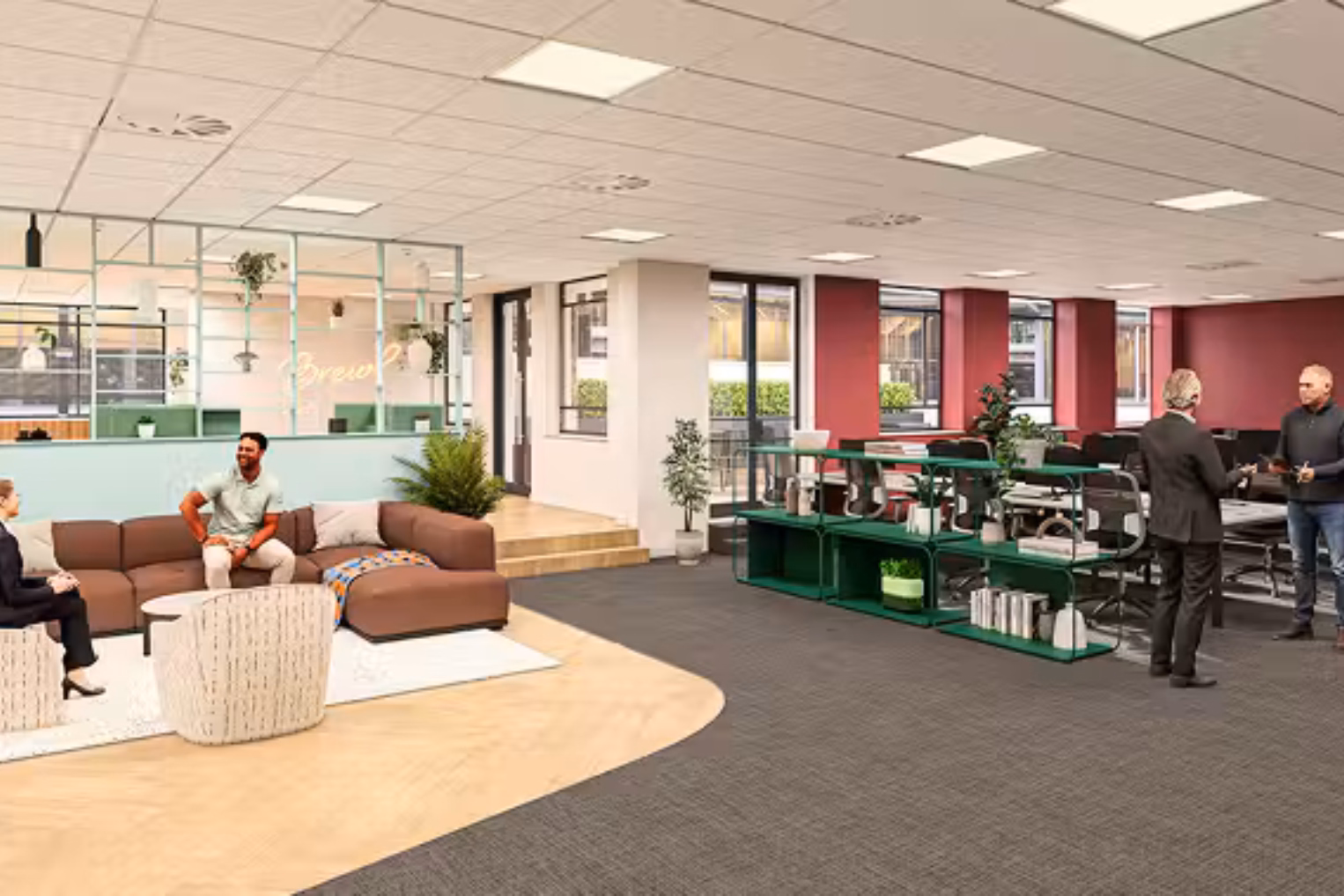 People chat in an open-plan office featuring a brown modular sofa and light patterned armchairs, with dark green low shelving units.