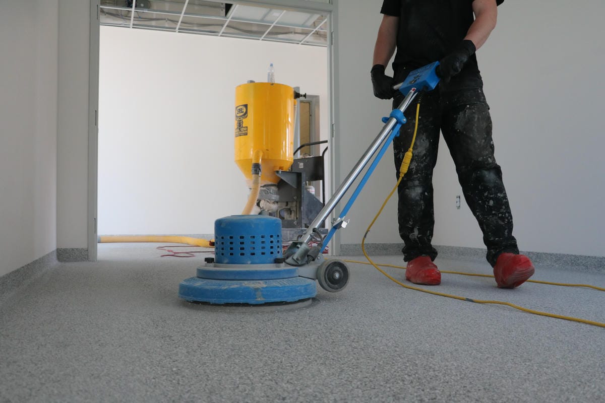 Industrial floor restoration and epoxy flake repair services in London, Ontario.