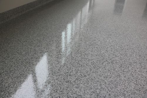 Sanitary epoxy flake floor with 4-inch radius cove in a London, Ontario health care facility.