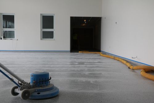 Epoxy flake floor with 4 inch rolled radius cove in School for Sarnia Ontario