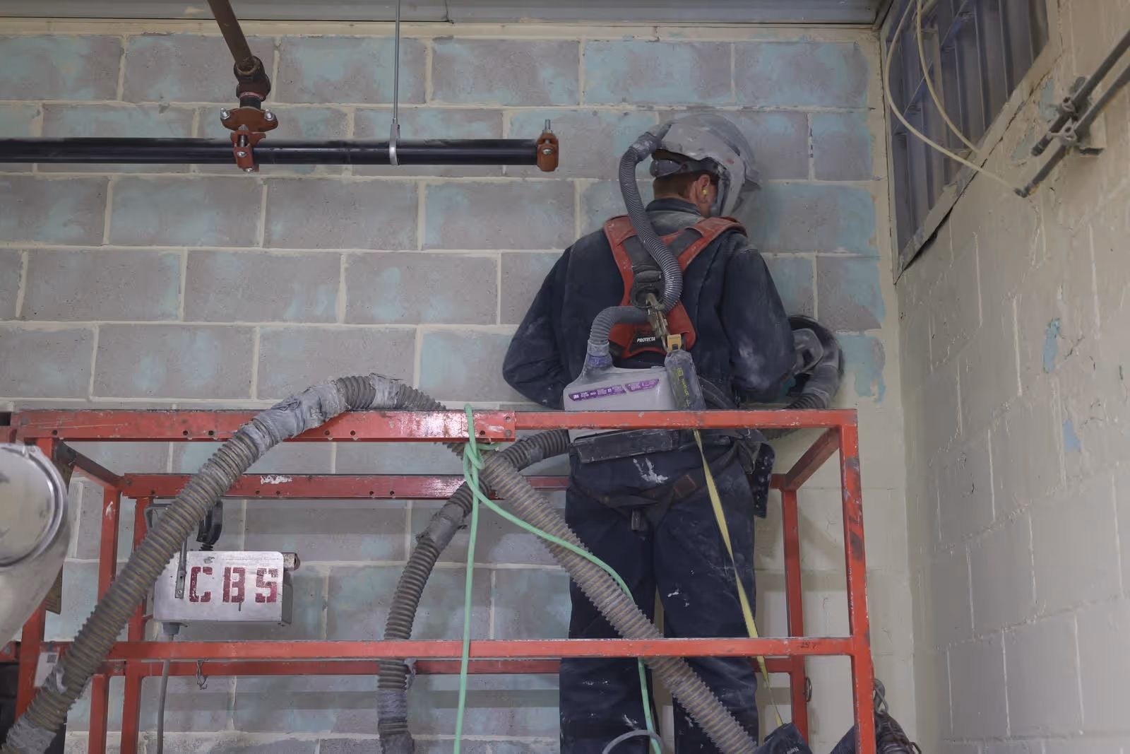 Heavy-duty wall coating for high-heat tower dryer room in a St. Marys food facility.
