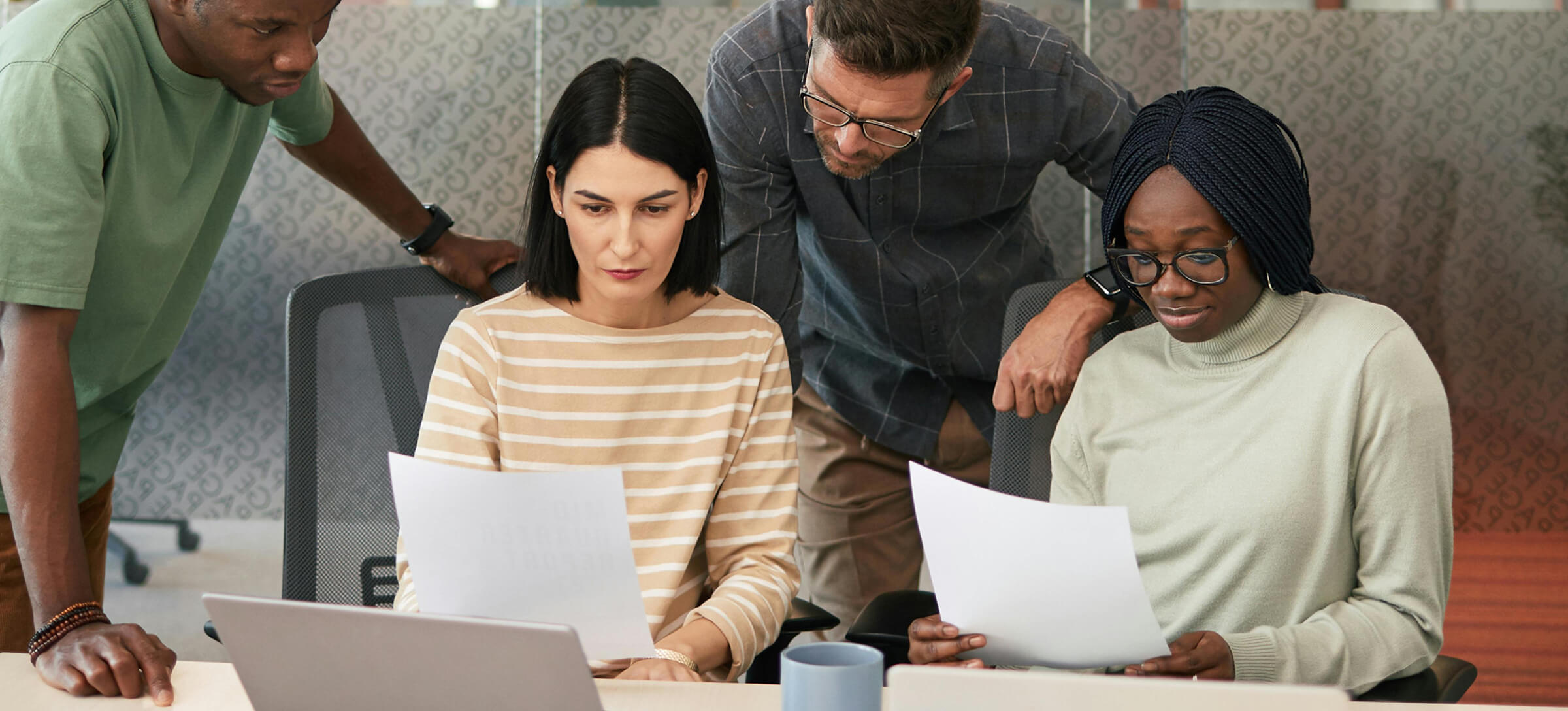 A group of people having a meeting in the office