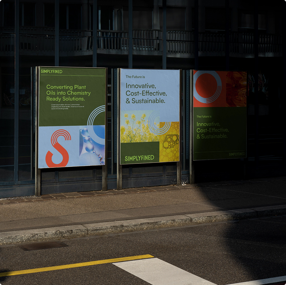 Branded Simplyfined posters displayed outdoors, showcasing the visual identity with bold typography, oil imagery, and the tagline highlighting innovation and sustainability.