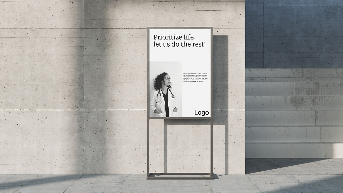 Minimalist poster mockup on a concrete wall, featuring a female doctor in black and white with the text “Prioritize life, let us do the rest!”