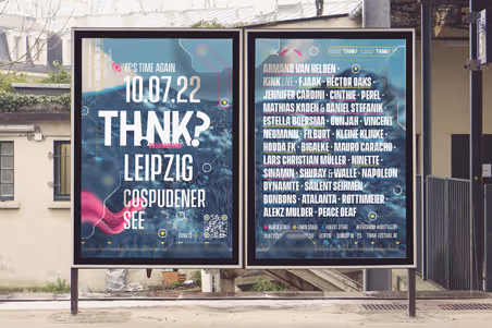 Two framed posters on a street display with event details and a list of performers for the THINK? music festival in Leipzig on 10.07.22.