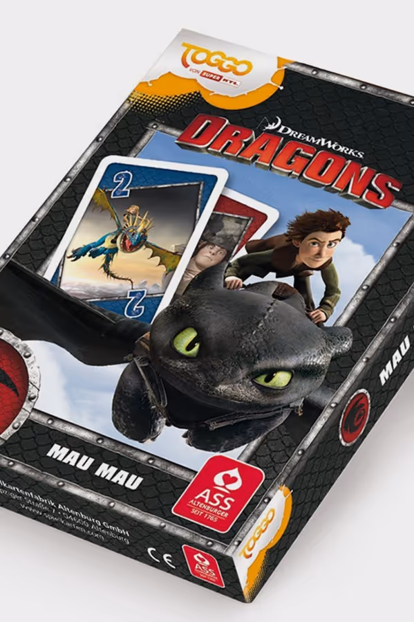 Box for DreamWorks Dragons Mau Mau card game featuring character Hiccup and dragon Toothless with game cards showing dragon illustrations.