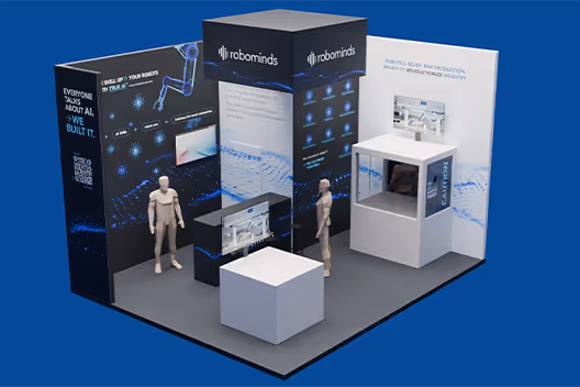 Robominds exhibition booth with informational panels, display screens, a white cube table, and two mannequins on a blue background.
