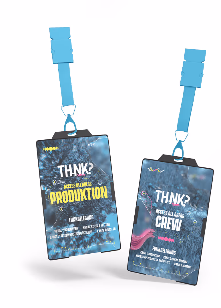 Two event access badges with blue lanyards; one labeled 'TH!NK? ACCESS ALL AREAS PRODUKTION' and the other 'TH!NK? ACCESS ALL AREAS CREW' with details about radio channel assignments.
