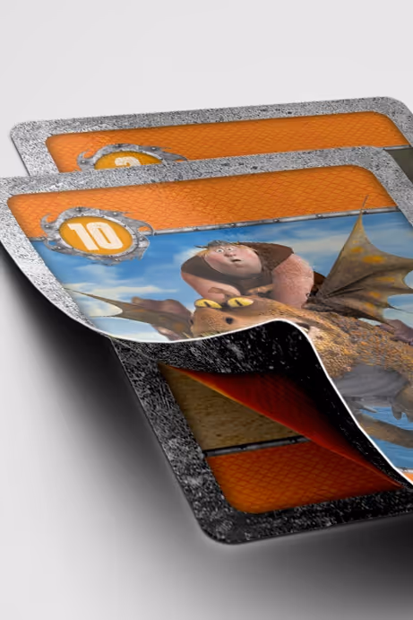 Three fantasy-themed game cards with orange backs and a card showing a character riding a dragon with a number 10 badge.