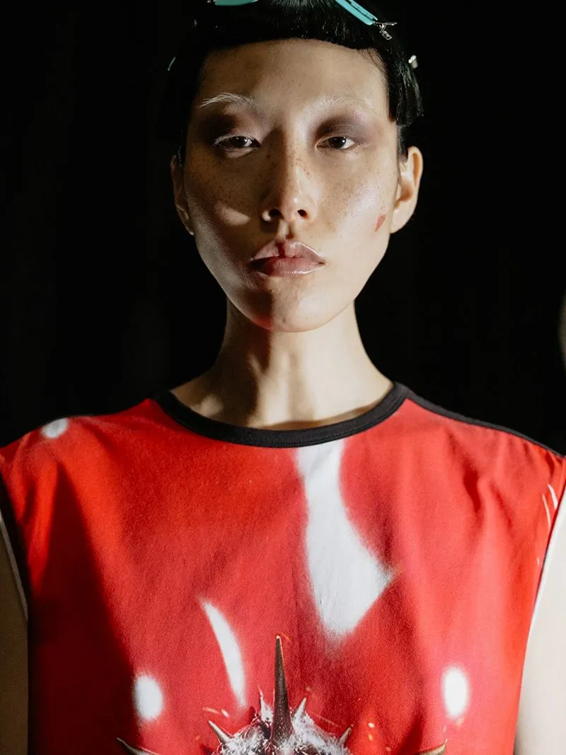 a woman in a red shirt