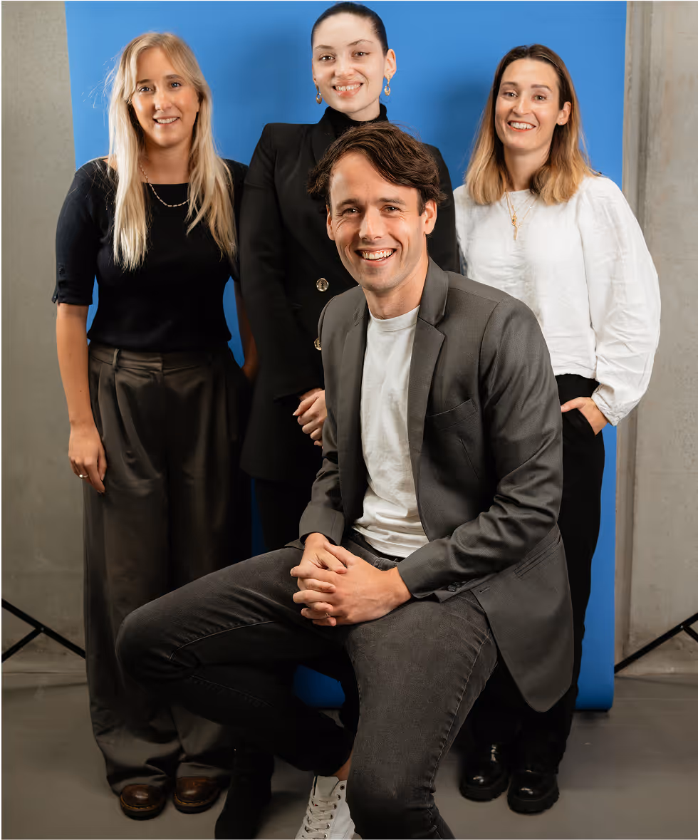 a group of people posing for a photo