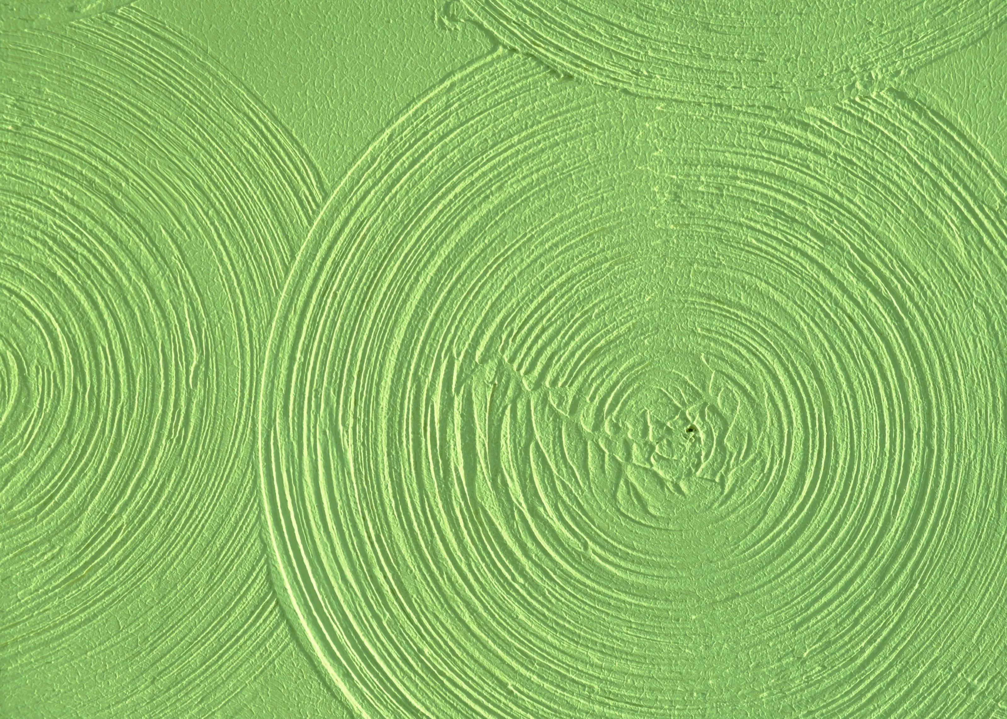 A close up of a green background with circles.
