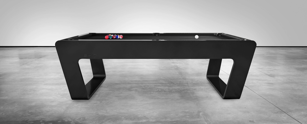 Modern black designer pool table in minimalist studio
