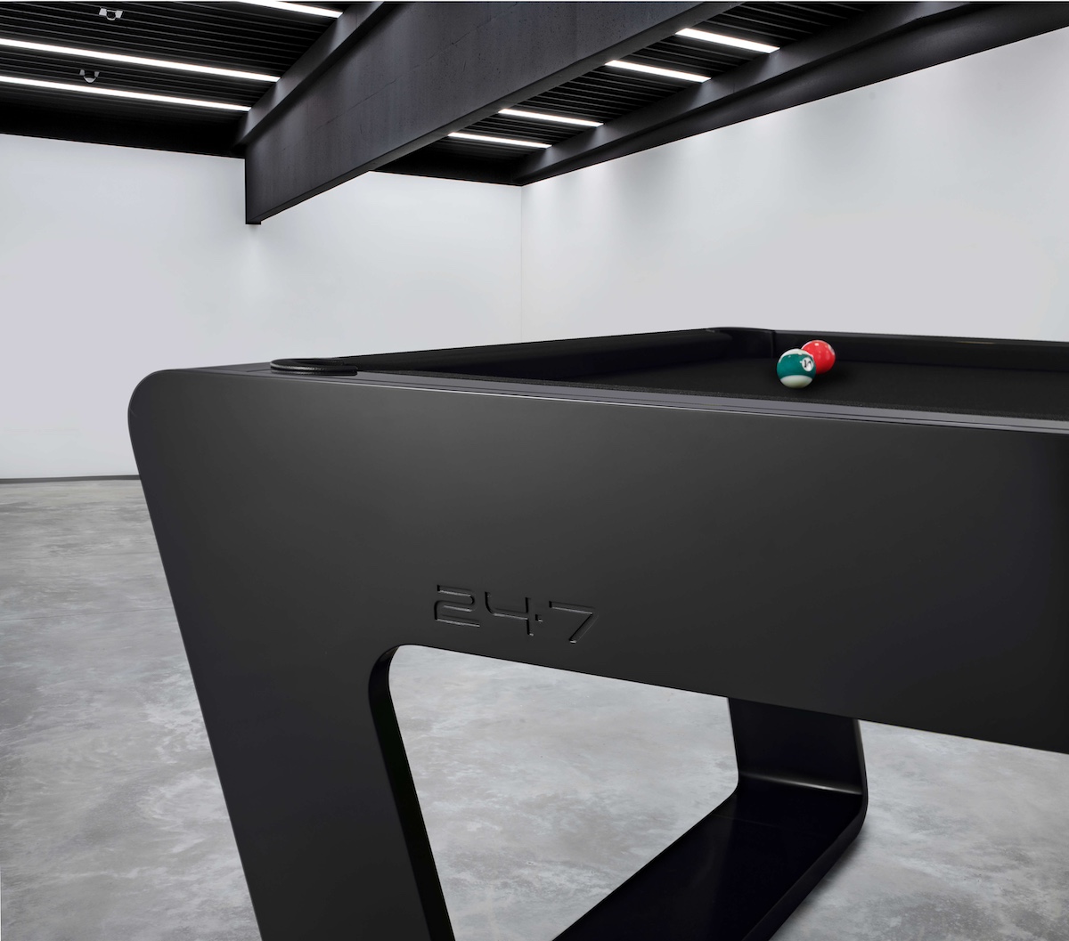 Modern black designer pool table in minimalist interior