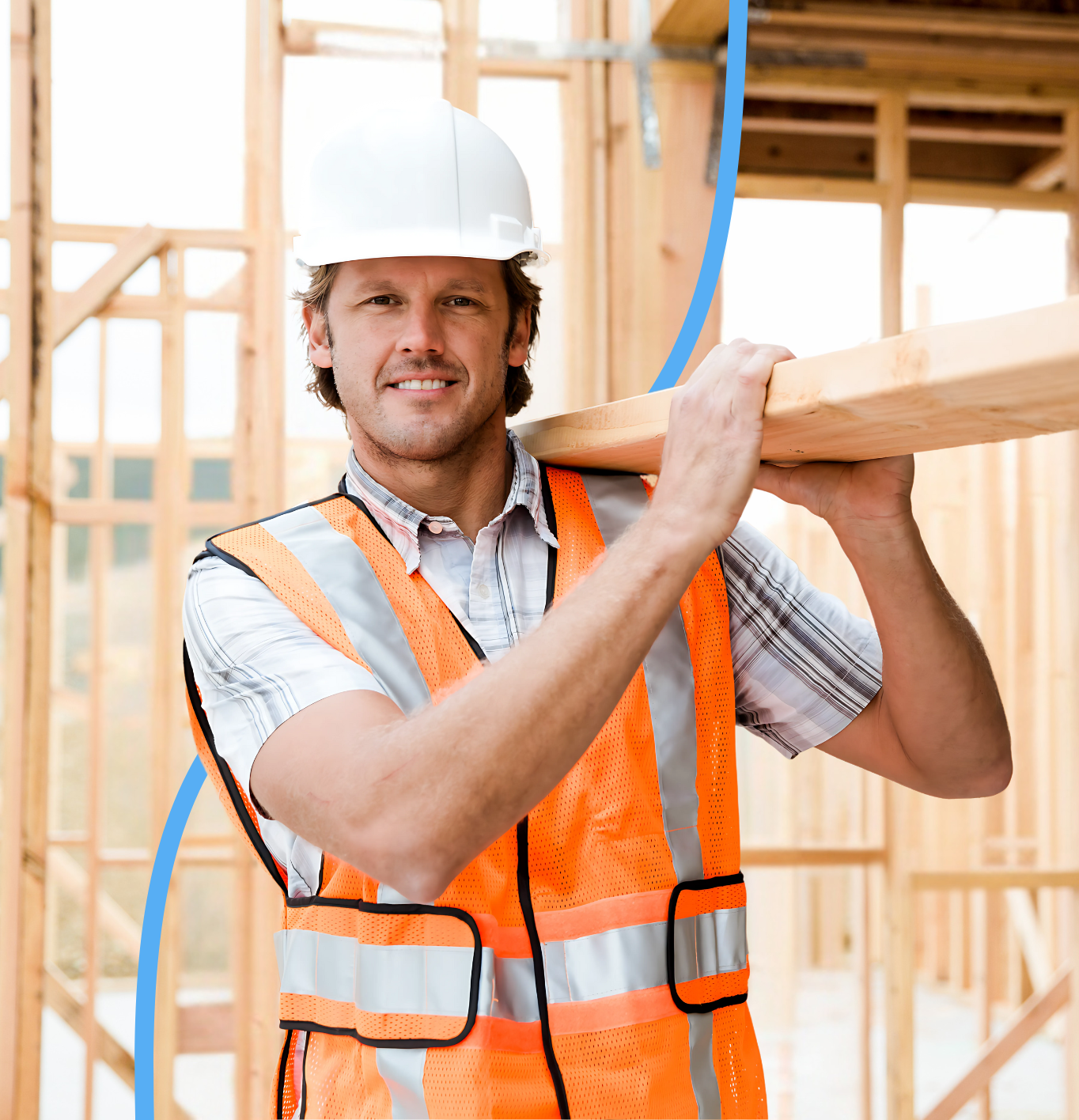 Our Worker caring a 2by4 while smiling