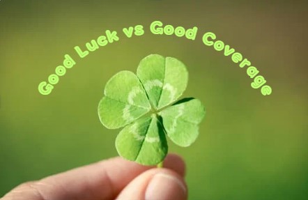 Four leaf clover and words good luck vs good coverage