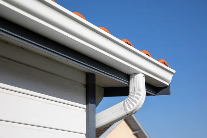 Eavestrough and gutter services - professional installation maintenance and repair to protect foundation and prevent water damage by Lodde Roofing
