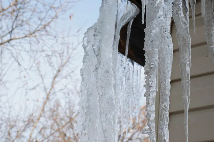 Ice dam removal services - safely eliminate ice dams prevent leaks and water damage while preserving roof structural integrity Lodde Roofing