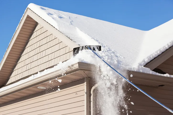 Winter roofing services and ice dam removal - emergency repairs for snow and ice damage keeping roofs safe through harsh Canadian winters