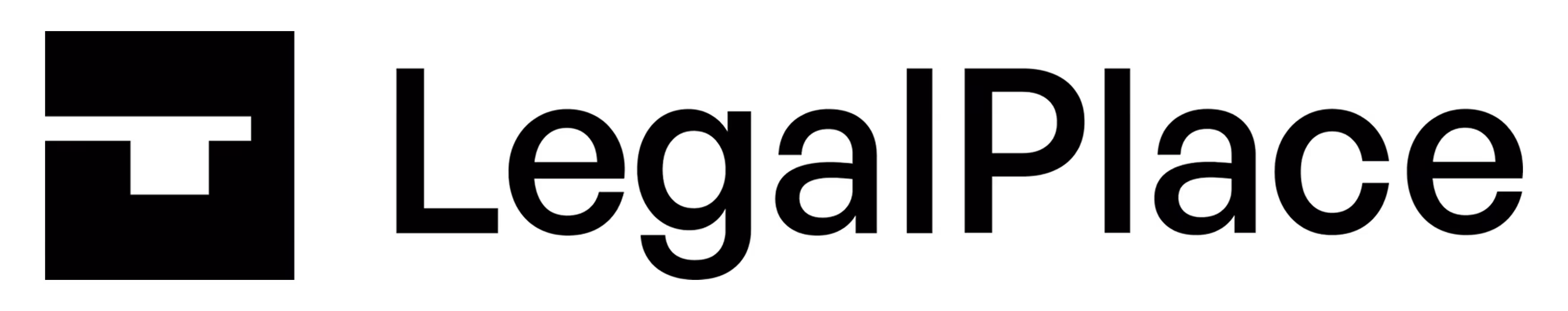 Silhouette of a person typing on a laptop with legal scales symbolizing justice on the screen, against a black background.