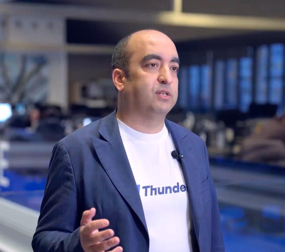 Man in blue blazer and Thunders white T shirt