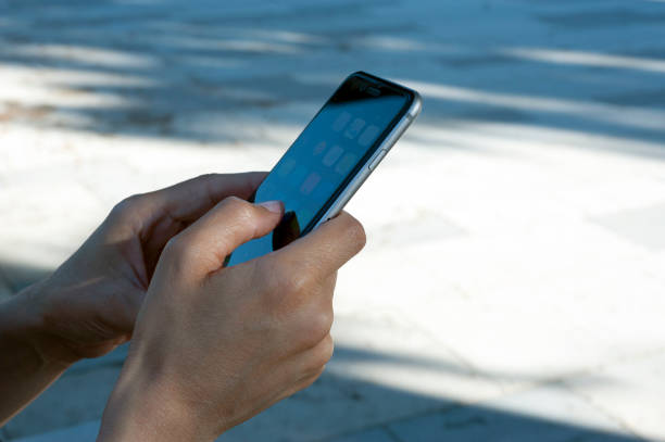 A woman is checking RSVP text message invite