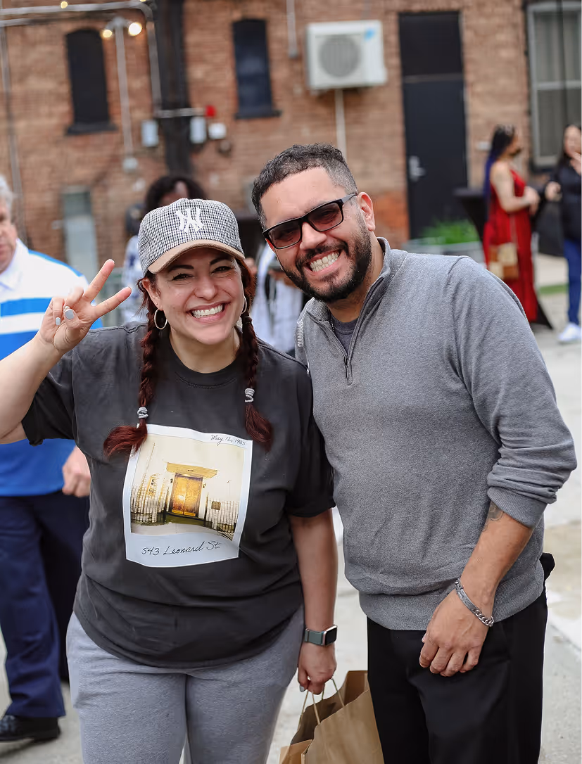 A woman and a man smiling for the camera
