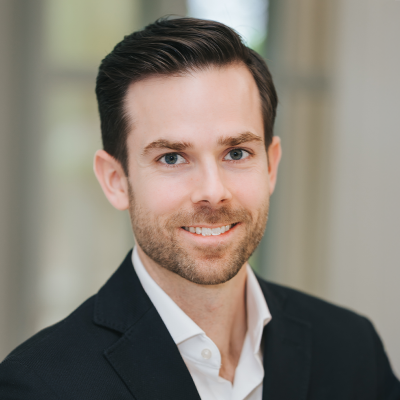 Professional headshot of Alex Graves