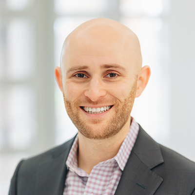 Professional headshot of Greg Alperstein