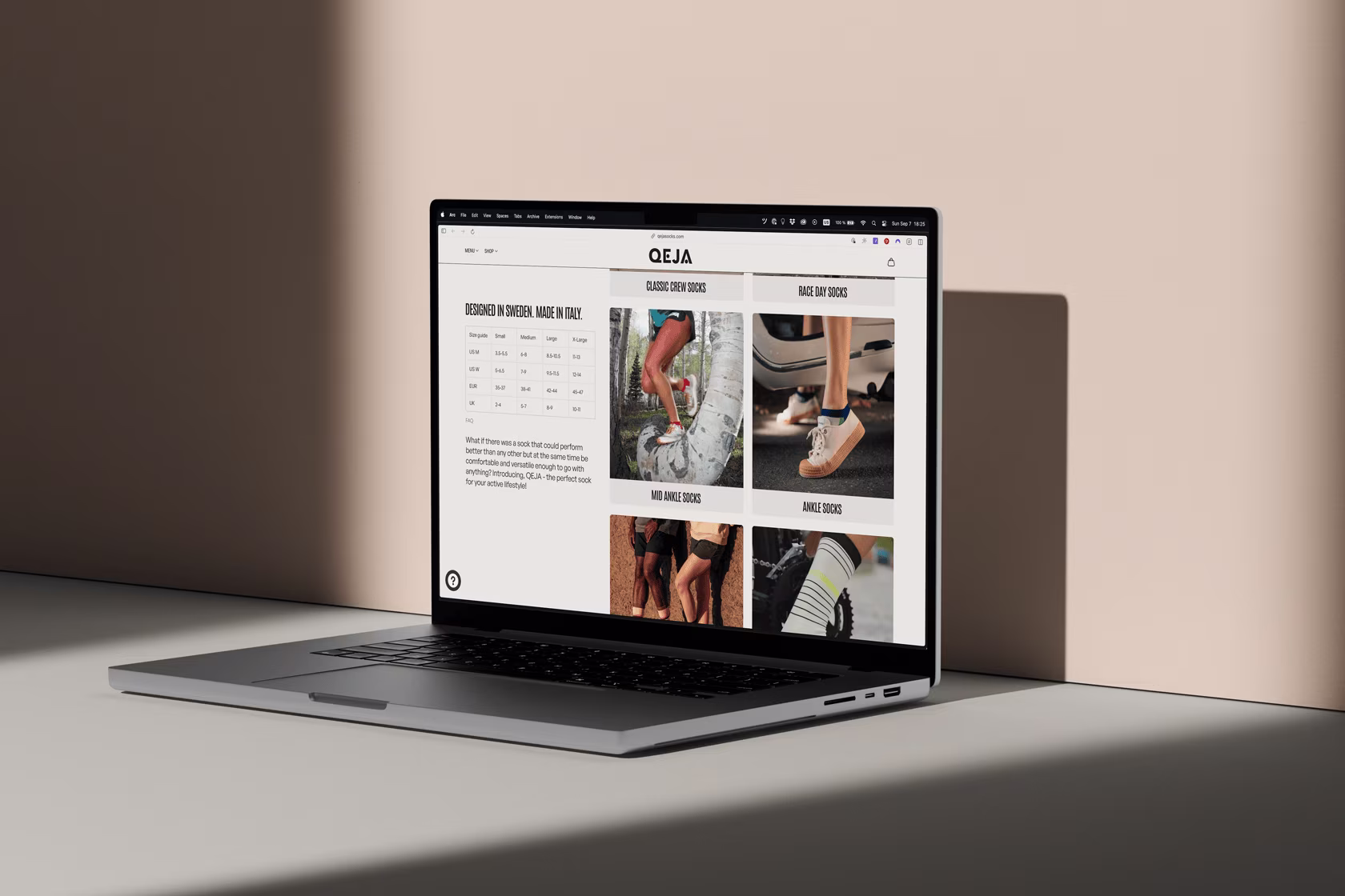 Open laptop on a beige surface displaying a website for Qeja socks with product images and size chart.