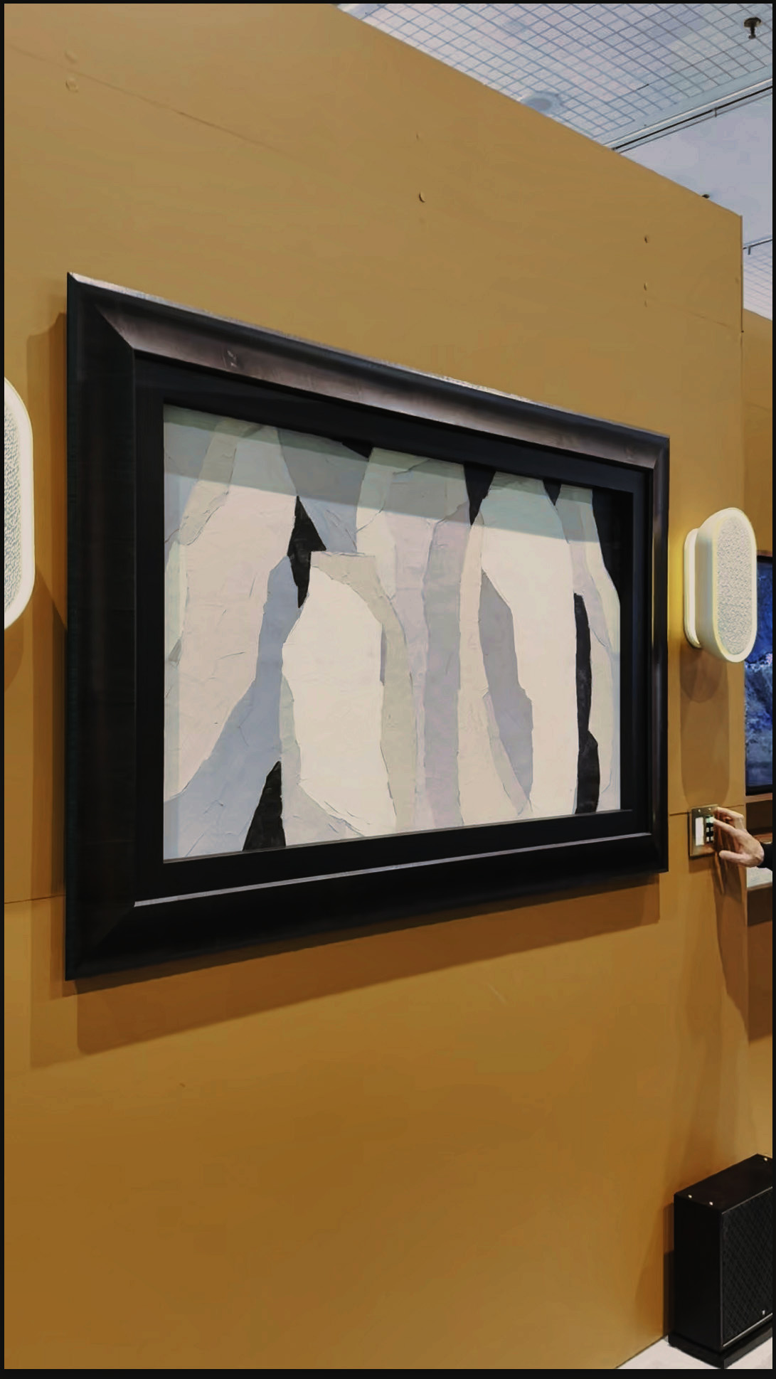 A black frame with a rolling art screen covering the entire TV, looking like framed art.