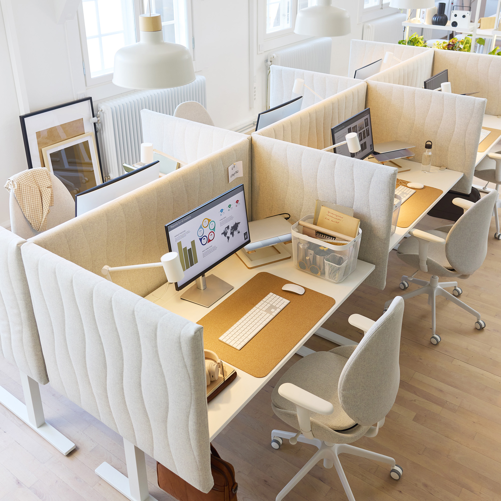 White plush desk walls with a sewn in waxy texture.