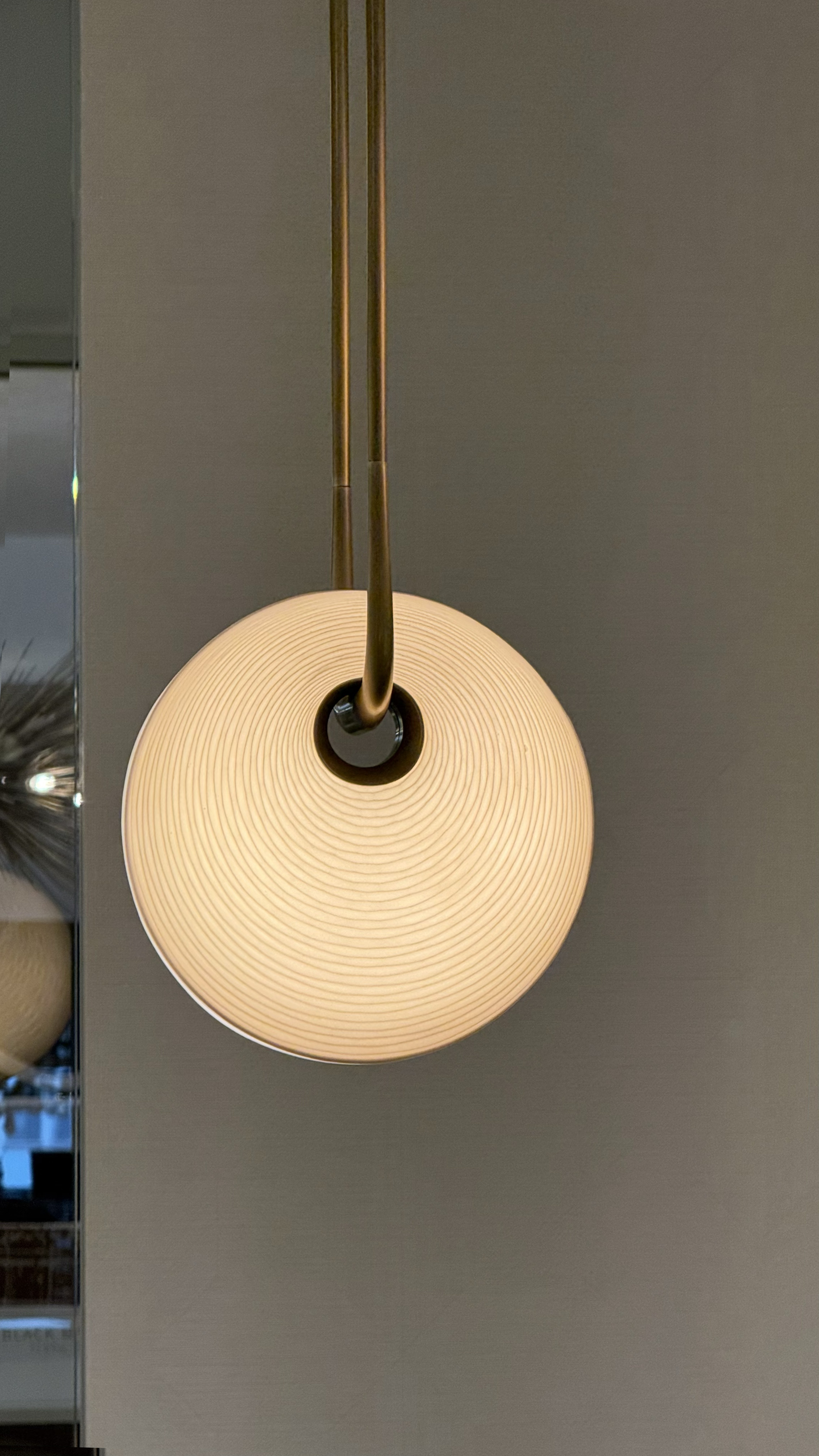 One textured circular hanging pendant lamp.