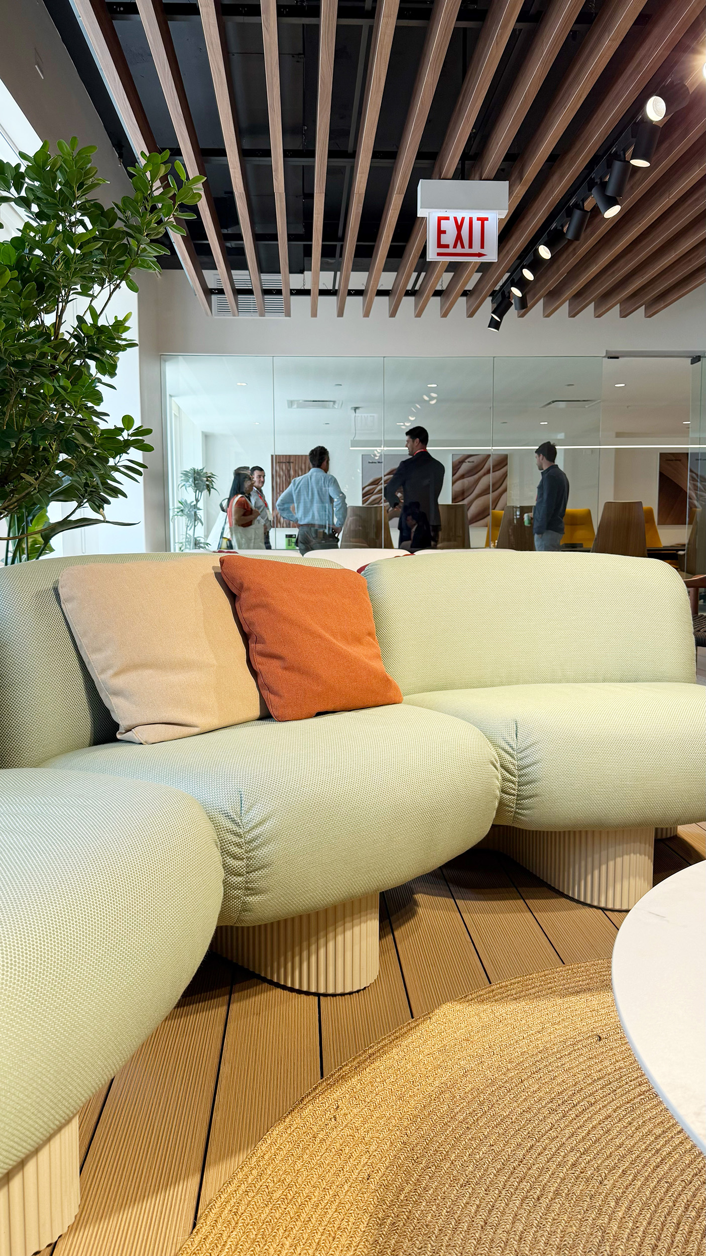 Light mint green sofa lounger with a white curvy base.