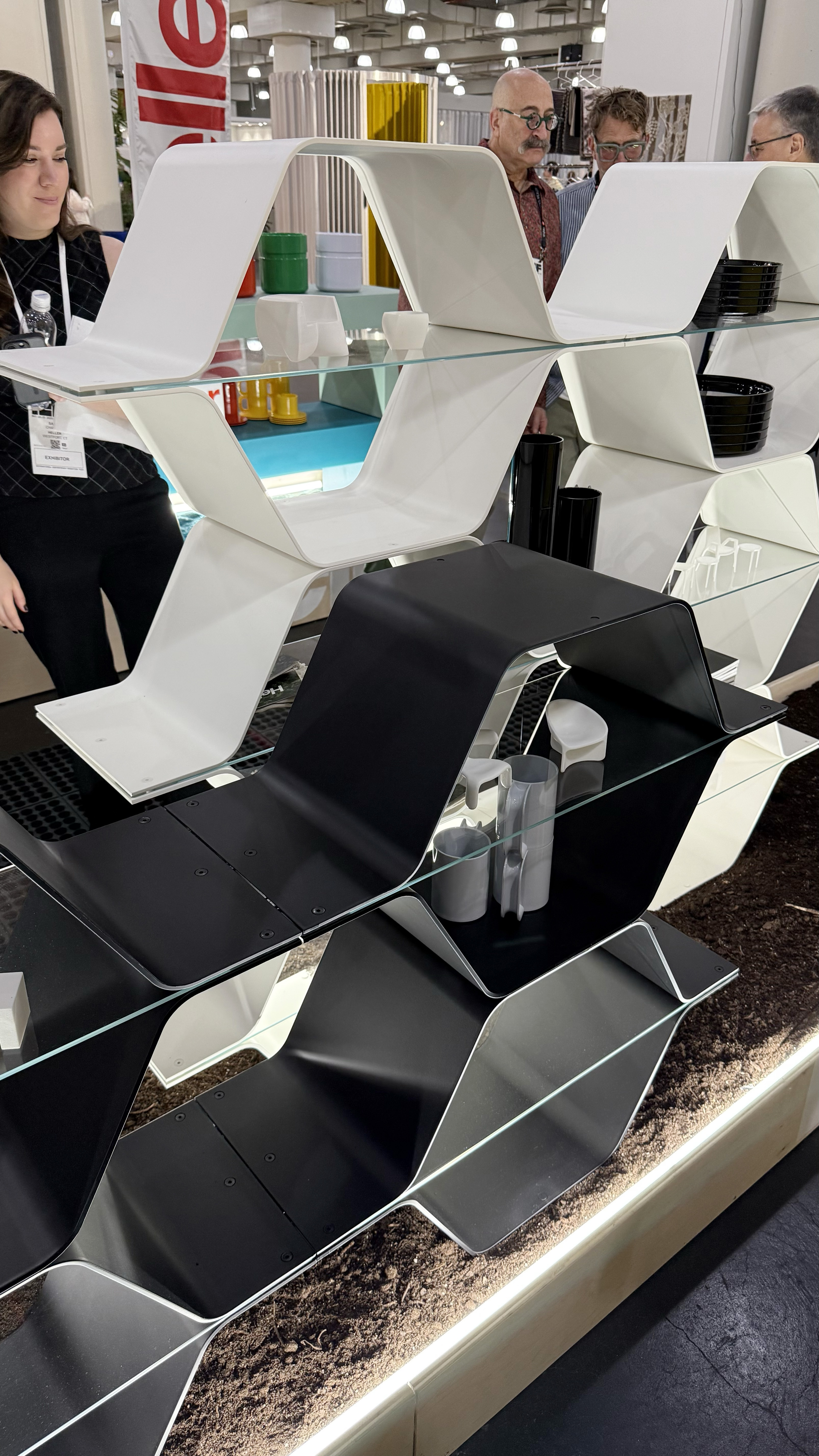 Black and white honeycomb shelves with a glass plate in between the honeycombs.