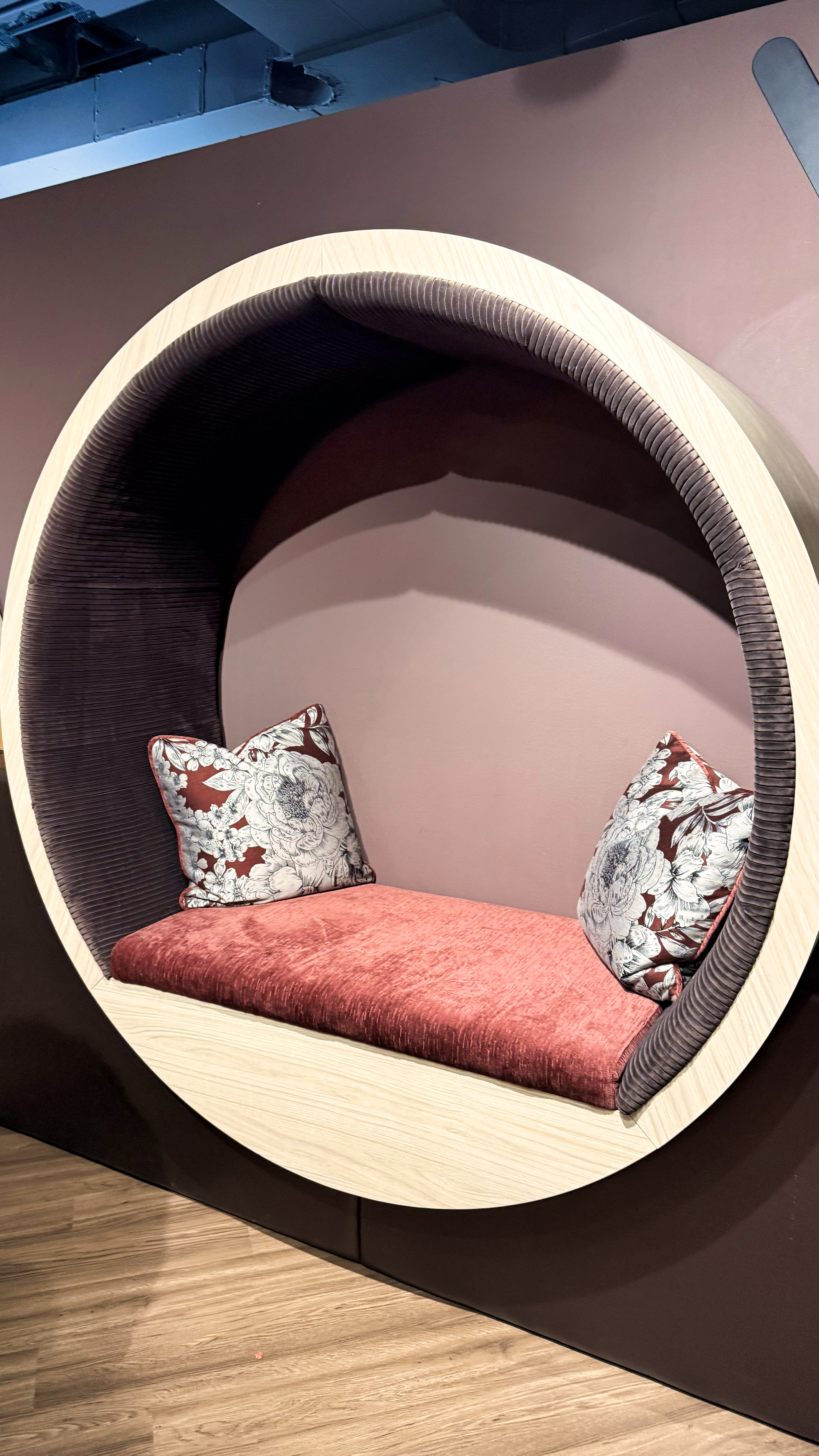 Purple circle against a wall with the bench at the bottom.